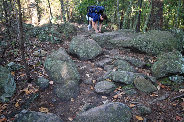 Photo of large rocks littering the trail on the ridge approaching the pinnacle