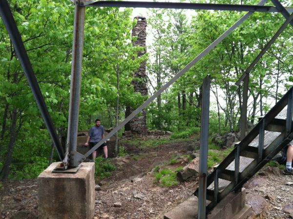 Photo of cabin ruins next to the tower